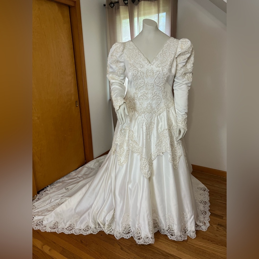Vintage ivory wedding gown with long puff sleeves and sweetheart neckline
